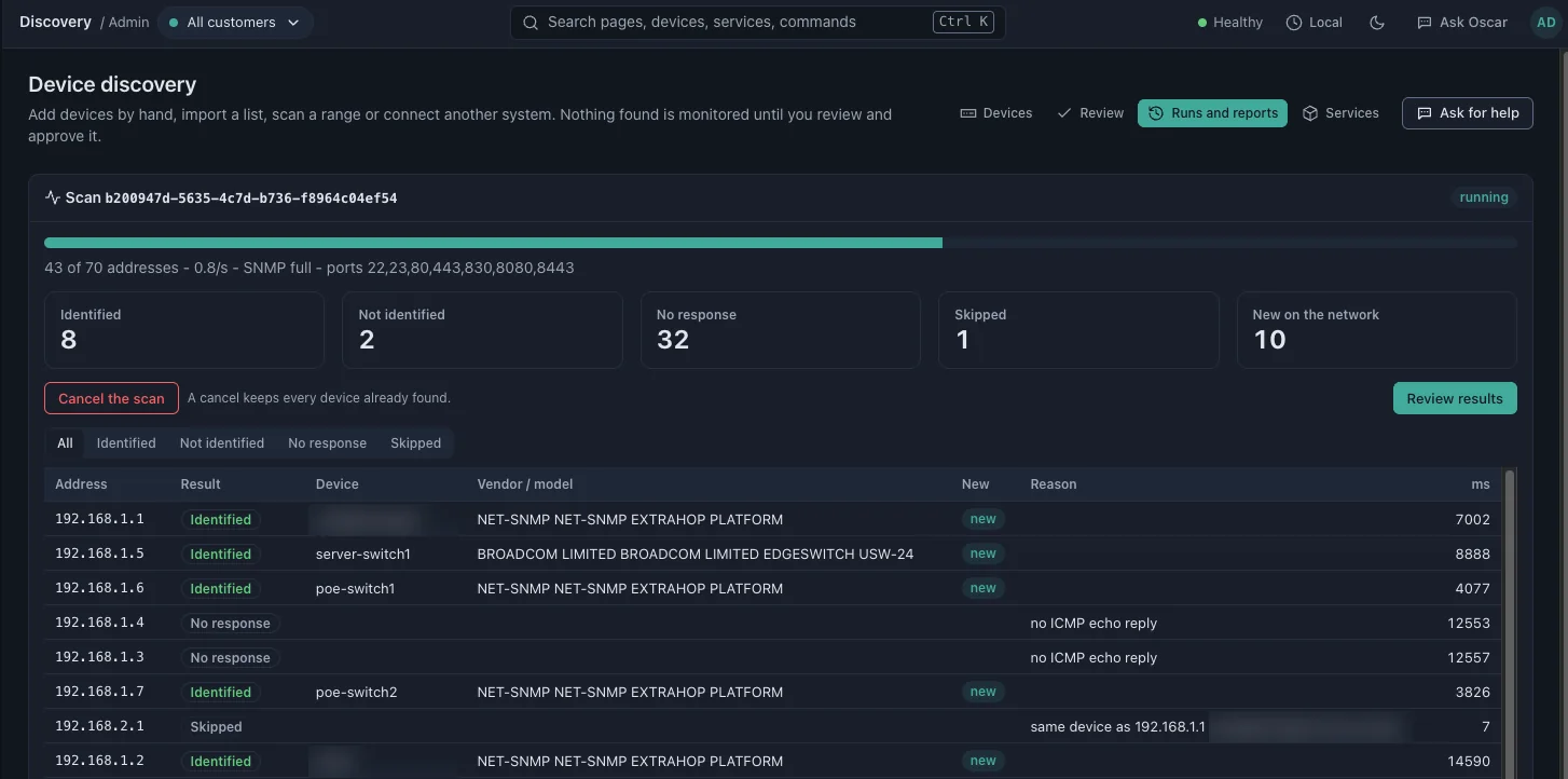 Device discovery wizard flagging new devices and a duplicate for review before anything is monitored